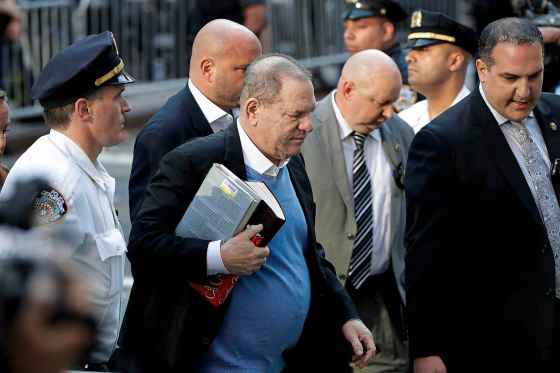 Julio Cortez / The Associated PressHarvey Weinstein arrives at the first precinct while turning himself to authorities following allegations of sexual misconduct, Friday, in New York.