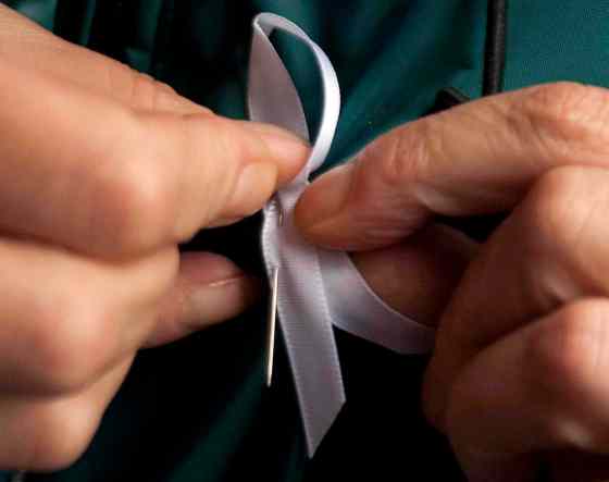 Ryan Remiorz / THE CANADIAN PRESS FilesA woman puts on a white ribbon in 2011 to mark the anniversary of the Ecole Polytechnique massacre.