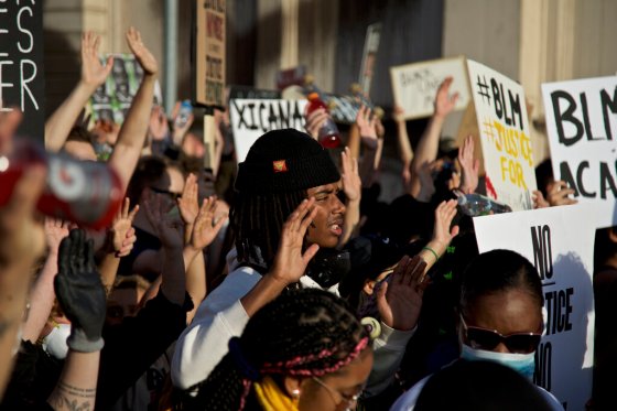 Craig Mitchelldyer / The Associated PressDemonstrators hold their hands up in Portland, Ore., during a protest over the death of George Floyd, who died May 25 after being restrained by police in Minneapolis.