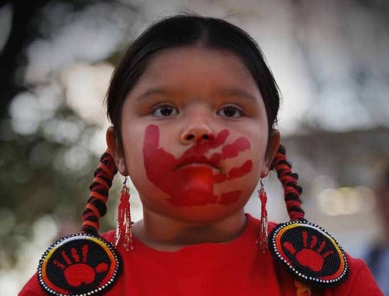 Anastasia, 5, sister of Eishia Hudson, who was shot by police, at the vigil Monday evening. (John Woods / Winnipeg Free Press)