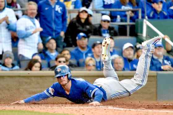 Nathan Denette / The Canadian Press filesToronto Blue Jays' Josh Donaldson slides into home plate to score against the Kansas City Royals during sixth inning game two ALCS playoff baseball action in Kansas City, Mo., on Saturday.
