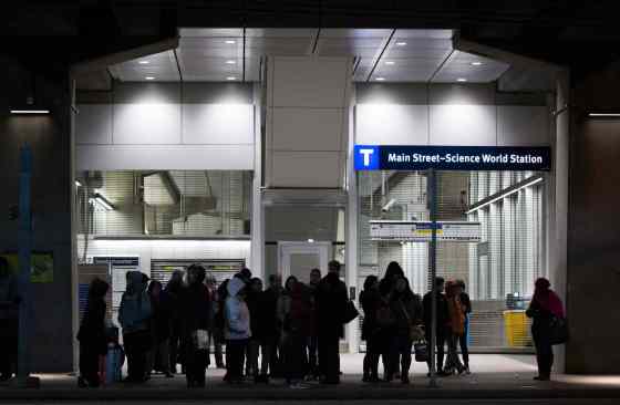 Darryl Dyck / THE CANADIAN PRESSPeople stand outside the Main Street Skytrain station after the commuter train system was shut down to check for any possible damage to elevated guideways in Vancouver, B.C., in the early morning hours of Wednesday, after an earthquake struck off the west coast late Tuesday night.