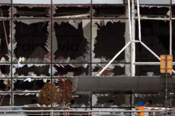 PETER DEJONG / THE ASSOCIATED PRESSThe blown-out windows of Zaventem airport are seen after a deadly attack in Brussels, Belgium, Tuesday. Authorities in Europe have tightened security at airports, on subways, at the borders and on city streets after deadly attacks Tuesday on the Brussels airport and its subway system.