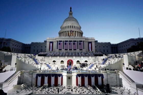 CPThe U.S. Capitol and a stage are lit as the sun begins to rise before the presidential inauguration. (Patrick Semansky / The Associated Press)