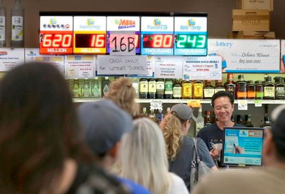 Rich Pedroncelli / The Associated PressPeople what in line to purchase lottery tickets for the Meg Millions lottery at Lichines Liqour & Deli, Tuesday, in Sacramento, Calif.