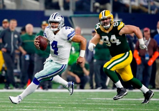 Michael Ainsworth / THE ASSOCIATED PRESSDallas Cowboys quarterback Dak Prescott (4) and Green Bay Packers defensive end Dean Lowry (94)  during the second half of an NFL divisional playoff football game Sunday.