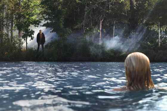 Postmedia News FilesChelsea (Willa Ford) discovers Jason (Derek Mears) watching her from the shores of Crystal Lake in 'Friday the 13th.'