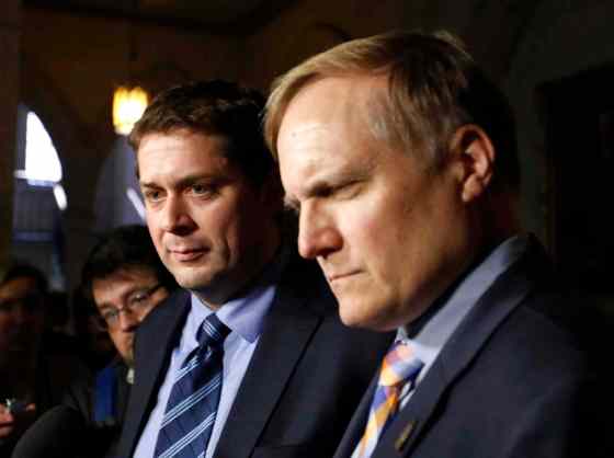 FRED CHARTRAND / THE CANADIAN PRESSConservative House Leader Andrew Scheer, left, and Peter Julian NDP House Leader talk to reporters after an incident in the House of Commons in Ottawa Wednesday.