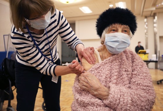 CPNina Luhowy, 93, gets her shot at the COVID-19 vaccination super-site on Monday. (Kevin King / pool)