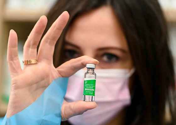 CPPharmacist Barbara Violo holds a vial of the AstraZeneca COVID-19 vaccine at a pharmacy in Toronto on Friday. (Nathan Denette / The Canadian Press files)