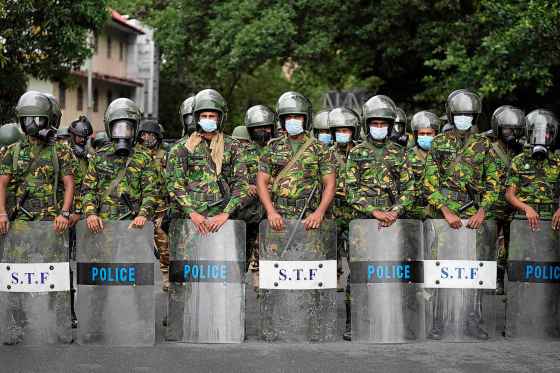 Police commandos stand guard at a barricade outside the president's office in Colombo, Sri Lanka. (Eranga Jayawardena / The Associated Press)