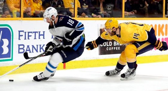 Mark Humphrey / THE CANADIAN PRESS FILESWinnipeg Jets centre Bryan Little (18) is chased by Nashville Predators defenceman Mattias Ekholm (14).