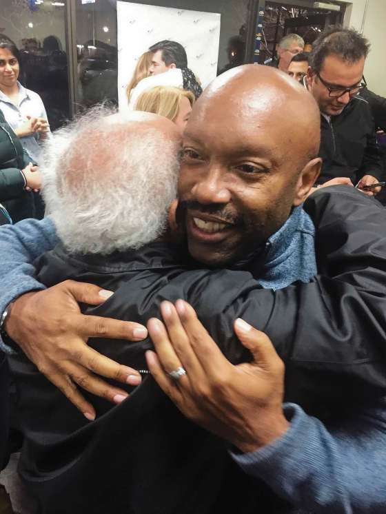 Photo by Simon FullerNewly elected St. Norbert-Seine River city councillor Markus Chambers hugs a supporter at his campaign headquarters after learning he’d won.