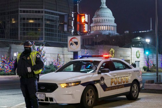 CPA U.S. Capitol Police officer stands watch on Independence Avenue early this morning before a joint session of Congress in Washington. (J. Scott Applewhite / The Associated Press)