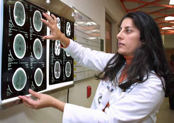 Adele Starr / The Associated PressA doctor looks at a CT scan of a brain. (Adele Starr / The Associated Press files)