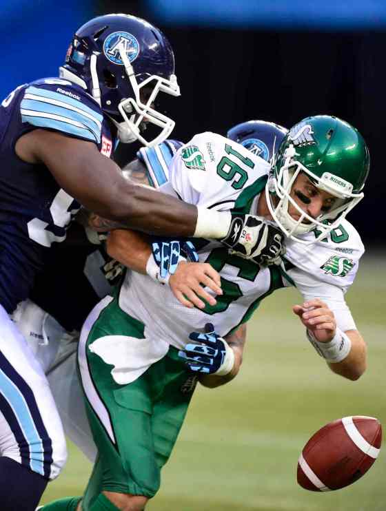 Frank Gunn / THE CANADIAN PRESS FilesSaskatchewan Roughriders QB Brett Smith is stopped by the Toronto Argonauts during a game in Toronto.