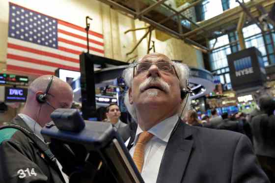 Richard Drew / The Associated PressTrader Peter Tuchman works on the floor of the New York Stock Exchange, Tuesday.