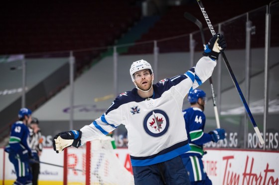 CPWinnipeg Jets forward Adam Lowry scored twice in the third period against the Vancouver Canucks last night. (Darryl Dyck / The Canadian Press)