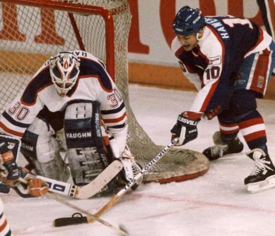 CPWinnipeg Jets forward Dale Hawerchuk tries a wraparound move on Edmonton Oilers goal Bill Ranford in April 1990, in the last playoff series between the Jets and Oilers. (Ray Giguere / The Canadian Press files)