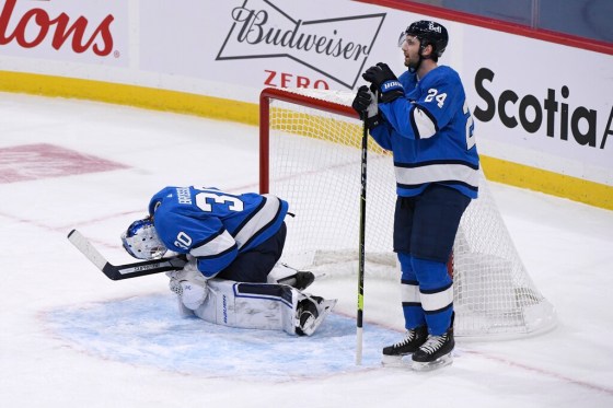 CPJets goaltender Laurent Brossoit and defenceman Derek Forbort after the Edmonton Oilers scored the game-winning goal on Sunday. (Fred Greenslade / The Canadian Press)