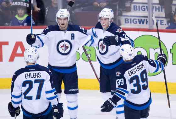 DARYYL DYCK / THE CANADIAN PRESSDARRYL DYCK / THE CANADIAN PRESSNikolaj Ehlers, Mark Scheifele, Patrik Laine and Toby Enstrom celebrate Laine’s second-period goal against the Vancouver Canucks Thursday night.