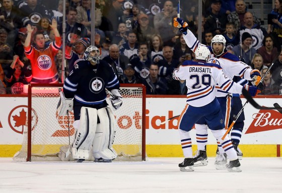 Trevor Hagan / THe Canadian Press Edmonton Oilers' Leon Draisaitl (29) celebrates with teammate Patrick Maroon (19) after Maroon scored on Winnipeg Jets' goalie Ondrej Pavelec (31) during the second period of Sunday's game.