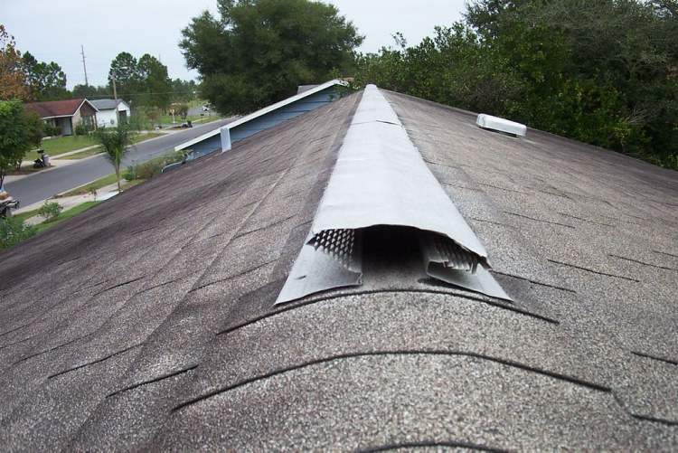 The benefit of ridge vents over traditional rectangular vents is the increased coverage over the entire upper portion of the attic instead of a few isolated locations. The downside is that installation requires removal of larger sections of roof sheathing and the increased cost over smaller individual vents.