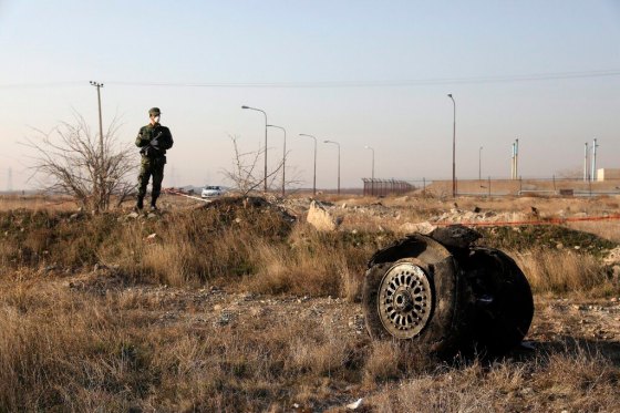 THE ASSOCIATED PRESSA police officer stands guard amid debris from a Ukrainian passenger jet that was shot down in Iran on Jan. 8, 2020. (Ebrahim Noroozi / The Associated Press files)