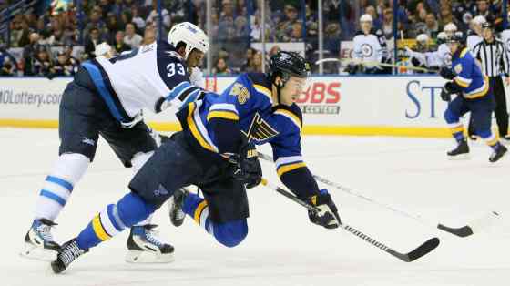 Chris Lee / St. Louis Post-Dispatch / The Associated PressSt. Louis Blues left wing Magnus Paajarvi is knocked down by Winnipeg Jets defenseman Dustin Byfuglien in period action of an NHL hockey game on Monday at the Scottrade Center in St. Louis.