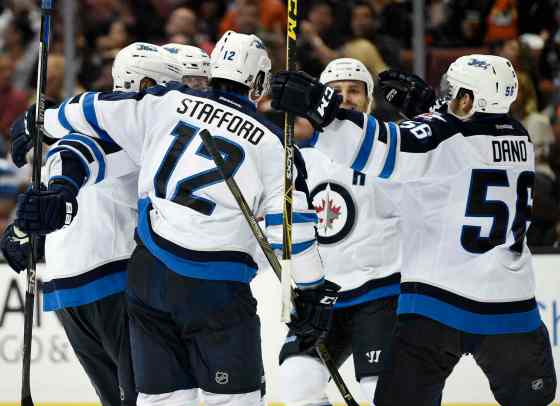 KELVIN JUO / THE ASSOCIATED PRESSWinnipeg Jets center Marko Dano, right, of Austria, celebrates with teammates after he scored the tying goal during the third period of an NHL hockey game against the Anaheim Ducks in Anaheim, Calif., TuesdaY. The Jets won 2-1 in overtime.