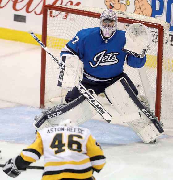 Connor Hellebuyck faces Aston-Reese.