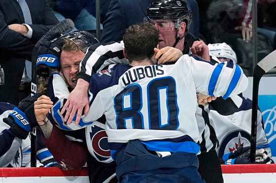 Jets winger Pierre-Luc Dubois fights with Colorado Avalanche winger Logan O'Connor. (Jack Dempsey / The Associated Press)