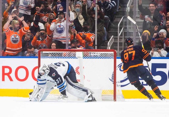 Connor McDavid scores on Connor Hellebuyck during the shootout. (Jason Franson / The Canadian Press)