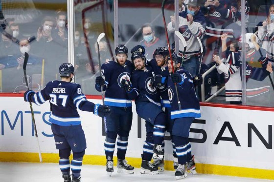 John Woods / The Canadian PressJets players celebrate after Josh Morrissey (centre) scored what proved to be the game-winning goal. (John Woods / The Canadian Press)