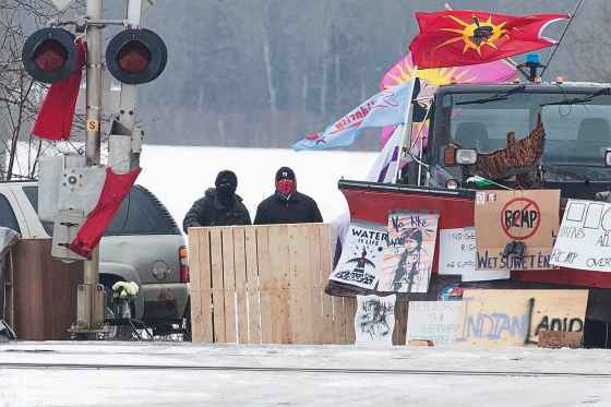 Lars Hagberg / THE CANADIAN PRESSProtesters stand near closed train tracks in Tyendinaga Mohawk Territory near Belleville, Ont. on Tuesday, as they protest in solidarity with the Wet'suwet'en hereditary chiefs opposed to the LNG pipeline in northern British Columbia.