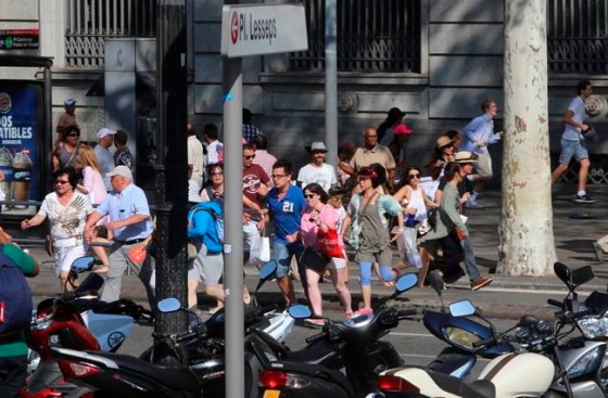 Oriol Duran / The Associated PressPeople flee the scene in Barcelona, Spain, Thursday after a white van jumped the sidewalk in the historic Las Ramblas district, crashing into a crowd of residents and tourists.