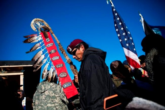 David Goldman / THE ASSOCIATED PRESSNative American veterans join an interfaith ceremony at the Oceti Sakowin camp where people have gathered to protest the Dakota Access oil pipeline in Cannon Ball, N.D., Sunday.