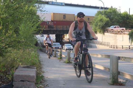Police are issuing more tickets to people riding bikes on sidewalks. (Cody Sellar / Winnipeg Free Press)