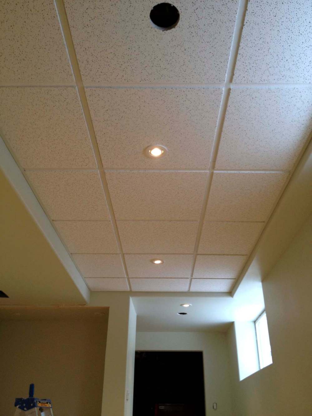 Photos by Marc LaBossiere
When closing in a ceiling is not an option, the suspended ceiling is a clean and attractive alternative that allows you access to services above the tiles.