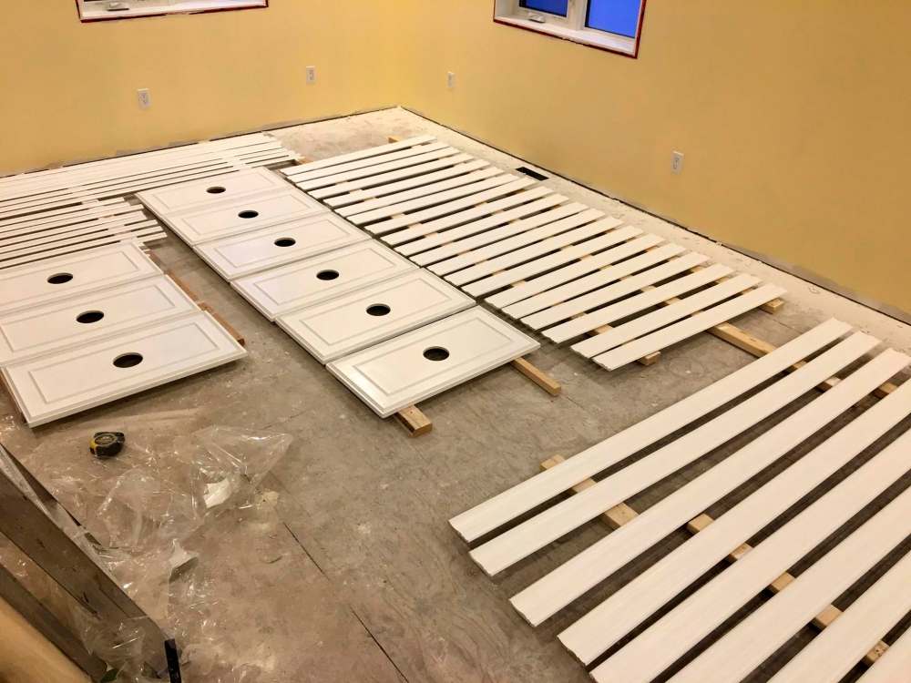 Marc LaBossiere / Winnipeg Free Press
Crown moulding, underside beam moulding and medallions are pre-painted with a white, satin-lustre trim paint prior to install.