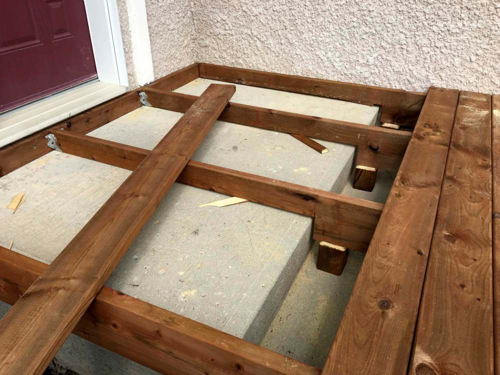 Marc LaBossiere / Winnipeg Free Press
The ledger and joists were customized to fit around the existing concrete steps below, which became entirely hidden once the top decking and fascia was installed.
