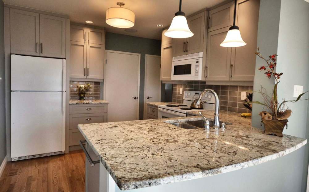 Lana Lounsbury Interiors
Out-of-date kitchens can be revitalized by introducing new lighting, a bold backsplash and even painting the cabinets. A paint job revives old cabinets and breathes new life into an old kitchen.