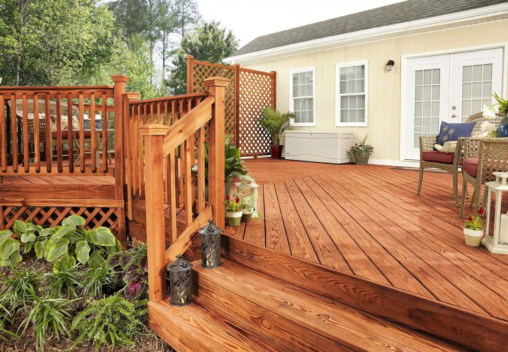 Lowe’s
A wood deck treated with Olympic Maximum Semi-Transparent Deck Stain. Regular foot traffic, sun and precipitation all lead to wear, regardless of which product you choose.