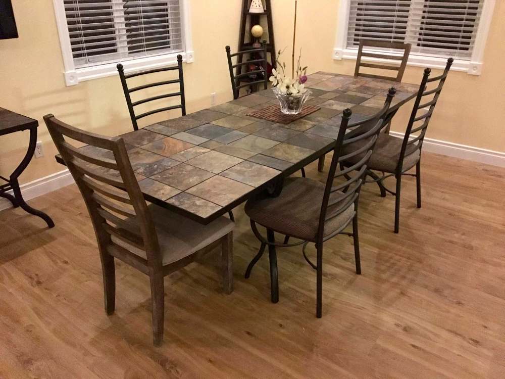 Photos by Marc LaBossiere / Winnipeg Free Press
With the leaves in place on either end of the table and supported below with metal dowels and conduit, the vinyl tile adequately matches the existing topside slate-tile inserts of the metal-framed table.
