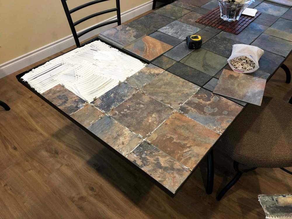 New vinyl tiles were used because actual slate ones would be too heavy for the tabletop.