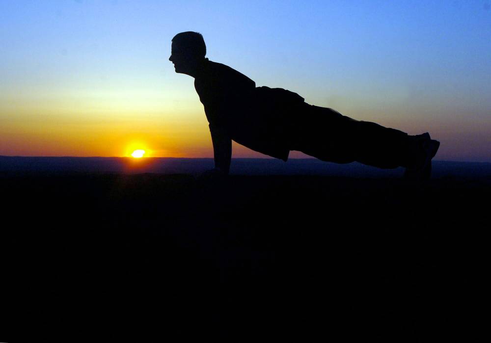 Jim Michaud / The Associated Press Files
You don’t need to head to gym to keep up your summer fitness plan. Your own body weight can help you stay fit on holidays with push-ups, squats, lunges and other exercises.