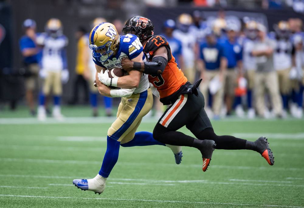 DARRYL DYCK / THE CANADIAN PRESS
Winnipeg Blue Bombers’ Dalton Schoen is tackled by B.C. Lions’ Delvin Breaux Sr. after making a reception during the second half.