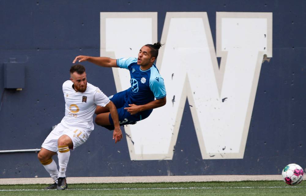 JOHN WOODS / WINNIPEG FREE PRESS
Valour FC’s Alessandro Riggi defends against HFX Wanderers FC’s Zachary Fernandez during second half Canadian Premier League action in Winnipeg Sunday.