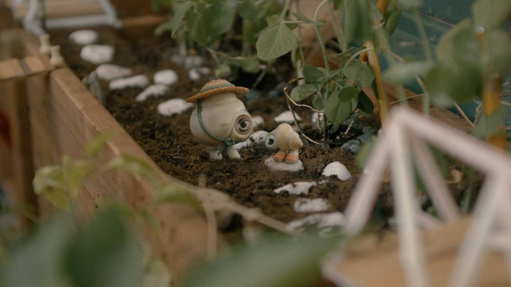 A24
Nanna (Isabella Rossellini) and Marcel (Jenny Slate) garden to keep their spirits up.