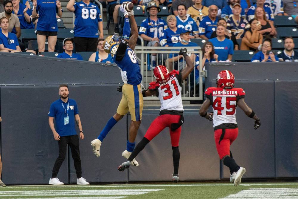 ETHAN CAIRNS / WINNIPEG FREE PRESS
Carlton Agudosi scores a touchdown for the Winnipeg Blue Bombers against the Calgary Stampeders at IG Field in Winnipeg, on Friday.